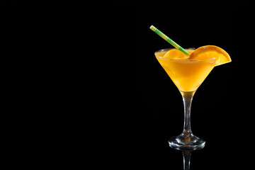 Refreshing orange cocktail with straw and citrus garnish