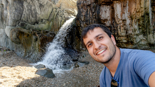 Man enjoying nature at Molin del Candano waterfall