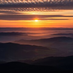 Sunset Over Layered Mountain Ridges with Golden Sky