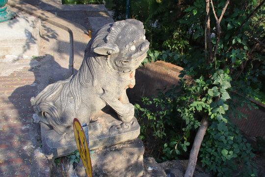 sculpted lion in a buddhist complex (wat phnom) in phnom penh in cambodia 