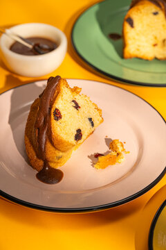 Slice of homemade sponge cake with chocolate sauce