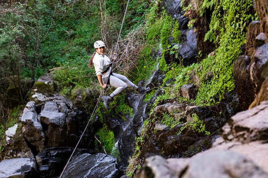 Outdoor adventure with rappelling in scenic nature