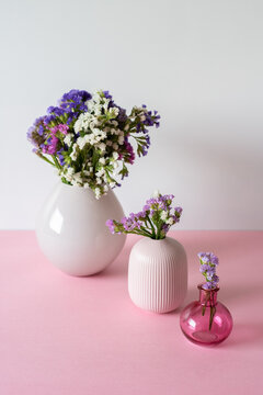Elegant flower arrangements in pastel vases