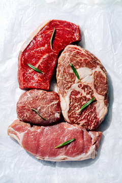 Assortment of premium steak cuts on white background
