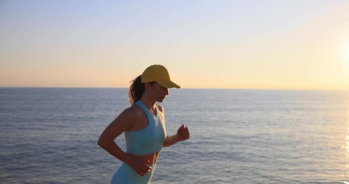 Athlete woman runner got sports injury running at the beach
