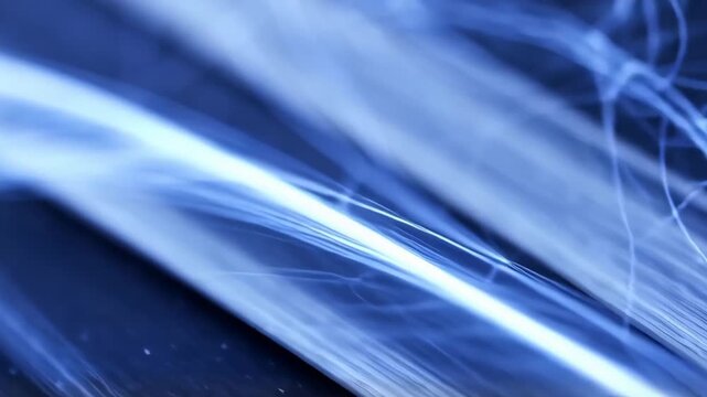 Cool blue smoke wisps drift diagonally with gentle swirling turbulence against a soft gradient, macro focus, slow lateral camera slide, calm atmospheric