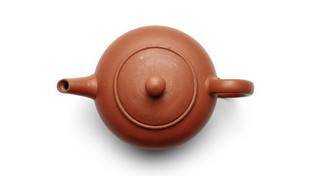 View from above of an ancient clay Chinese teapot on a white background with a clipping path