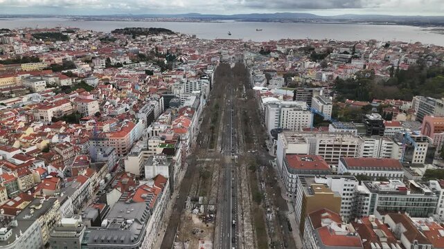 Aerial view of rooftops and roadways creates a textured tapestry in this sprawling cityscape, Lisbon, Lisbon, Portugal.