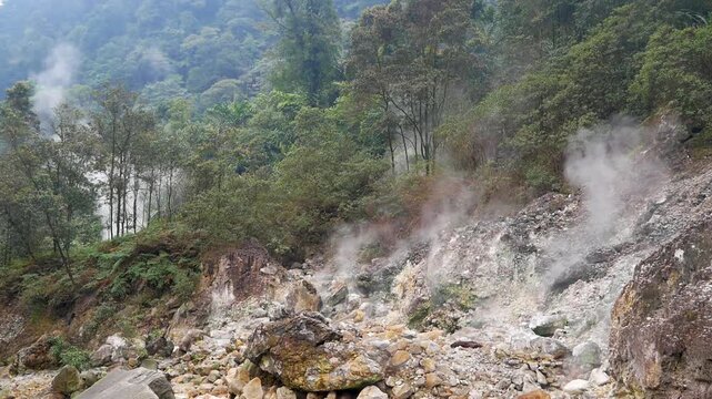Active volcanic crater emitting geothermal steam is located in the Curug Cikawah waterfall area, within the Mount Halimun Salak National Park, Bogor, West Java, Indonesia.