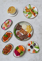 Abundant Ramadan table with mixed grill, lentil soup, fresh salads, and traditional Turkish dishes served elegantly.
