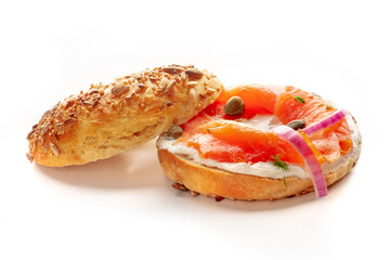 Lox, smoked salmon, bagel, with cream cheese and onion, and capers, and dill, on a white background, isolated, a healthy breakfast