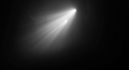 Minimalist black and white abstract of a foggy alley with scattered light rays and copy space