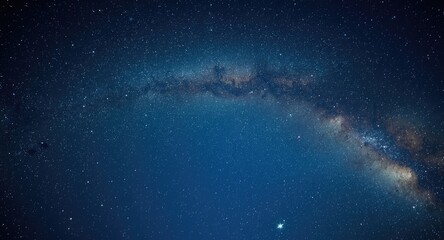 Fototapeta premium Starry expanse with the Milky Way arching across a clear night sky
