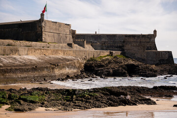 Fortress walls and rocky shoreline on Cascais coast