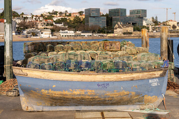 Fishing boat loaded with traps in Cascais harbor