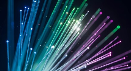 A vibrant display of colorful light beams radiating from a central point against a dark background