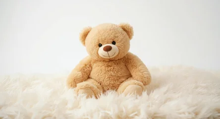 Fotobehang Dierenarts Joyful teddy bear baby sitting on a soft white fur blanket with copy space backdrop  © TheWaterMeloonProjec