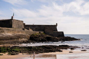 Cascais fortress walls overlooking Atlantic coastal rocks