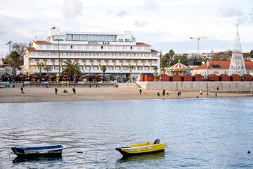 Cascais beach waterfront with hotel Baia and anchored boats
