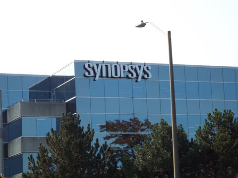 Nepean, ON, Canada-July 14,2025: The "Synopsys" corporate building features a modern glass facade with a large white logo on Antares Drive.