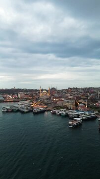Aerial View of the Historical New Mosque (Yeni Camii) and Emin&ouml;n&uuml; Square at Sunset, Istanbul, Turkey