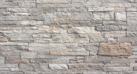 Obraz premium Natural stone wall background with rough grain texture and high key lighting for presentations
