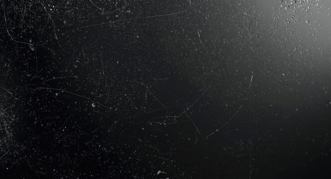 glass pane texture with dirt particles and white marks against a deep dark backdrop