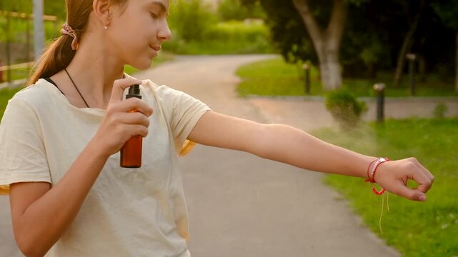 Spray mosquito repellent outdoors. Selective focus. nature.