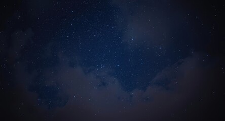 Obraz premium radiant stars shining through a cloudy night sky