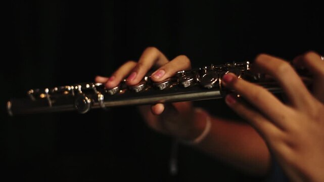 Close-Up of Musician Playing Flute in Studio