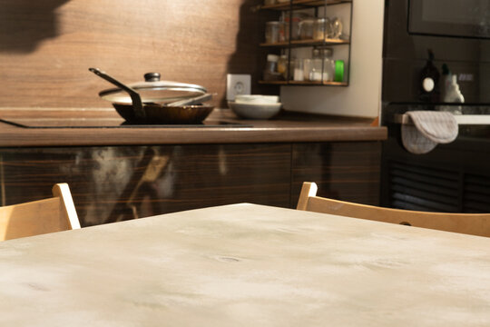 Dining table with copy space on background with kitchen sink and countertop composition 