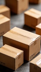 Cardboard boxes arranged on a dark surface, ready for shipping and delivery