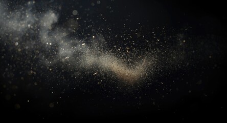 Obraz premium Close up depiction of airborne debris and dust particles on a dark studio background
