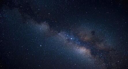 Fototapeta premium A sweeping panorama capturing the night sky studded with sparkling stars and intricate nebulae