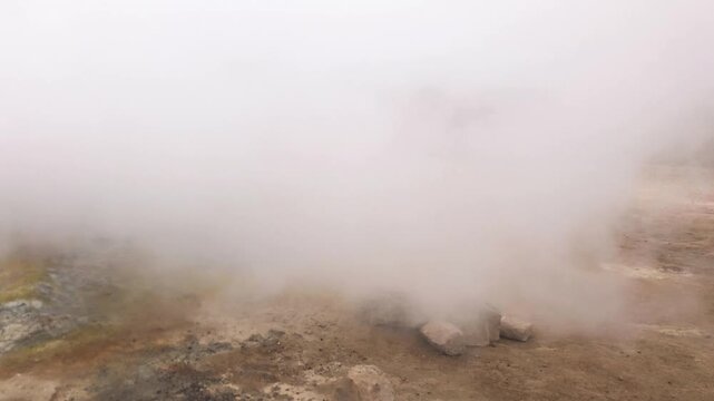 Dramatic Hverir geothermal field showcasing boiling mud pools and sulfur terrain in Iceland