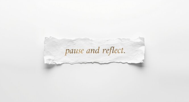 White surface featuring torn paper placed centrally with pause and reflect text