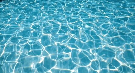 Obraz premium Reflective light blue pool floor with ripple patterns and sun glare for wallpaper use