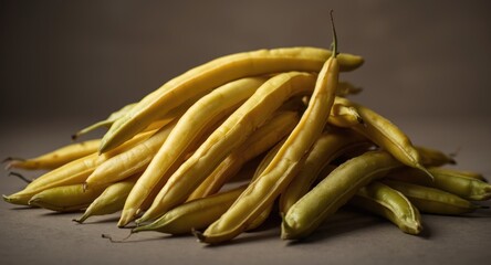 Yellow green beans in a natural heap showing pod contours