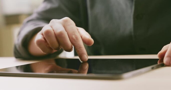 Female hand using a digital tablet