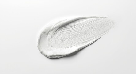 White facial peeling mud texture with delicate brush strokes on a smooth white background including copy space