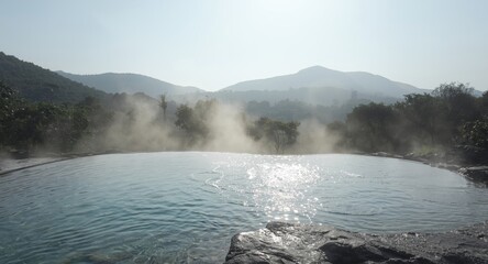 Tranquil solitude environment shaped by volcanic mineral springs and early mist