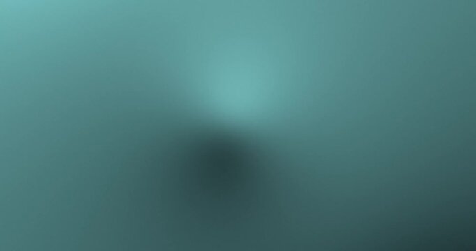 Abstract blurred ice blue and black gradient background video. Smooth cool dark tones with subtle fade, soft shadows, and misty light diffusion. Minimal elegant 4K seamless loop for motion graphics