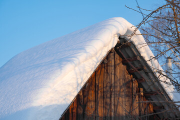snow drifts on the roof of the house, dangerously overhanging boulders, cyclone