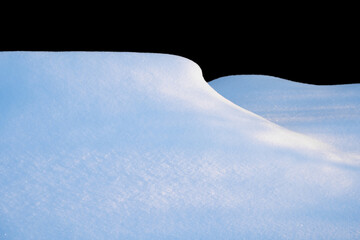 white snowdrift with blue shadows, winter texture