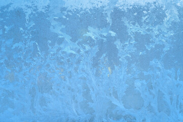 Fototapeta premium snow frost on the window glass, natural patterns, isolated from the background