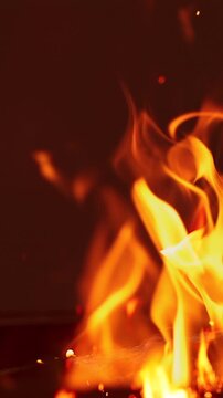 Close-up of Intense Fire Flames with Flying Sparks. Vertical