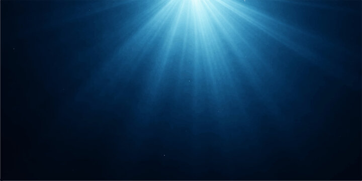A bright blue star burst explosion creates glowing light rays and sun beams in a deep sea ocean backdrop with motion flare and underwater sunlight design