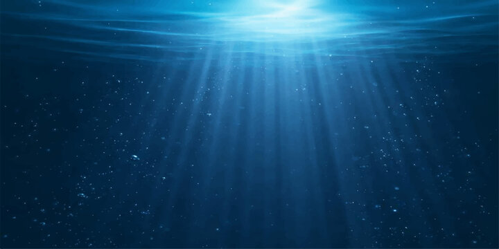 Deep blue ocean waves reveal an underwater world loop where bright sunlight rays shine through the dark sea water in a burst of nature design