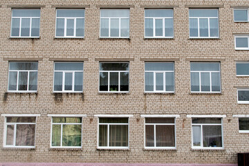 Fototapeta premium View of a building wall with windows