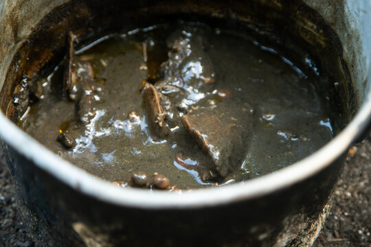 Cooking relleno negro in a pib, an ancestral Mayo method of cooking in the ground used on the Yucatan Peninsula.
